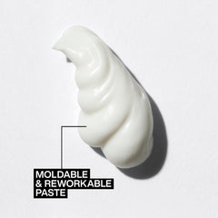 Redken paste on hands demonstrating spreadability and easy application
