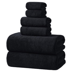 REDKISS front view of black towel set showing neat stacked towels and packaging benefit