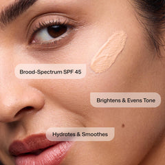 Revision Intellishade applied on cheek close-up showing sheer coverage and natural look benefit