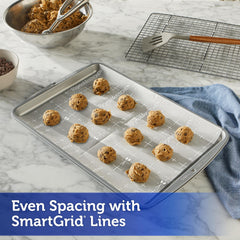 Reynolds pre-cut sheet placed on a cookie sheet for instant, no-cut setup benefit