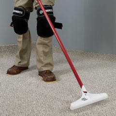 ROBERTS rake in use on living room carpet restoring pile for improved vacuuming