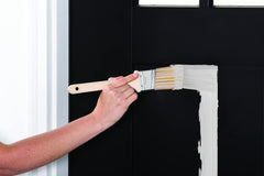 Before and after door painted with Rust-Oleum Satin White illustrating fast transformation and improved curb appeal