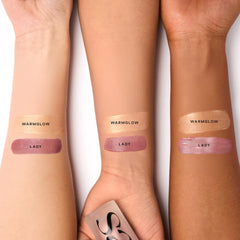 Saie Dew Liquid Blush in Lady doe-foot applicator close-up showing creamy texture for smooth blending