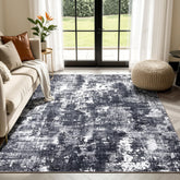 Sasttie front view of 8x10 rug showing bold black and white abstract design and visual impact