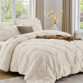 Sasttie front view comforter on queen bed showing polished pintuck elegance and cozy appeal