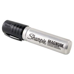 Sharpie Magnum marker writing bold black text on raw wood surface