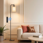 SIBRILLE floor lamp front view showing modern silhouette and ambient benefit