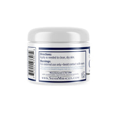Silver Miracles jar open with visible cream highlighting easy scoop and application