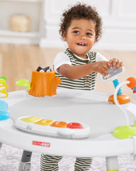 Skip Hop light-up musical piano demonstrating auditory stimulation and interactive play