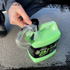 Slime sealant being poured into an off-highway tire to prevent flats