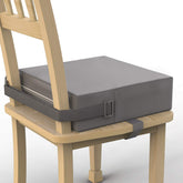 SMZCTYI booster seat front view on dining chair showing neat fit and added height benefit
