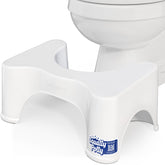 Squatty Potty front view showing compact white design and ergonomic shape benefit