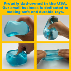 Squeez'M cube mid-squeeze showing slow-rise gel rebound and satisfying tactile feedback