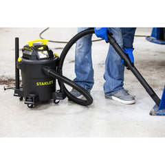 STANLEY vacuum hose and nozzles laid out for versatile cleanup tasks