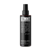 STMNT grooming spray front packaging showing bottle and label, benefits visible
