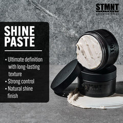 STMNT paste in hand being applied to hair, delivers strong control benefit