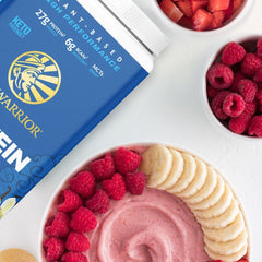 Sunwarrior vanilla protein mixed in a glass showing creamy shake and recovery support