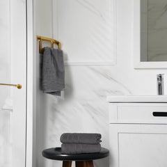 Tens Towels hanging on a bathroom rail showing quick-dry convenience