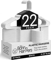 The Boring Hangers front pack showing 22 white hangers and tidy storage benefit