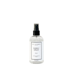 The Laundress front bottle view showing label and elegant packaging benefit: clear product ID