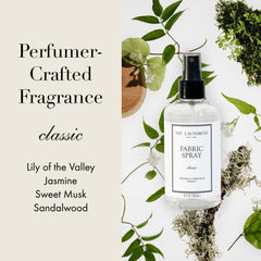 The Laundress being misted from a hand to fabric showing quick on-the-go wrinkle release