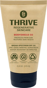 Thrive Natural Care front packaging showing SPF50 and reef-safe benefit