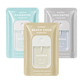 Touchland front packaging trio showing three travel bottles and portability benefit
