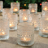TRIRITE front view clear hobnail glass votive holder showing elegant shape and glow