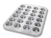 USA Pan mini muffin pan front view showing full 24-cup layout and even spacing
