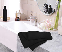 Utopia Towels beside ruler showing 16x28 size for scale and practical fit
