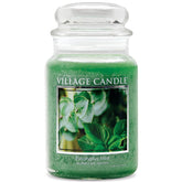 Village Candle front view of green apothecary jar showing label and color benefit: attractive décor