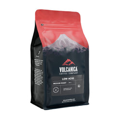Volcanica Coffee front packaging showing 16-ounce bag and benefit of low acidity