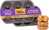 Wilton gold donut pan front view showing full cavities and clean finish for consistent baking