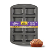 Wilton gold mini loaf pan front view showing eight cavities and durable finish for even baking