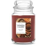 Yankee Candle front jar showing Kitchen Spice scent and long burn time benefit