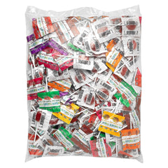 YumEarth lollipop in hand demonstrating individual wrap convenience and portability