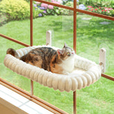 Zakkart SnugCloud front view on window showing secure attachment and sunny seat