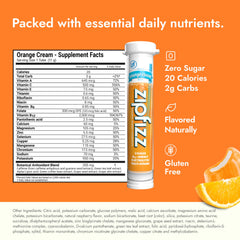 Single Zipfizz Orange Cream tube beside water bottle for convenience