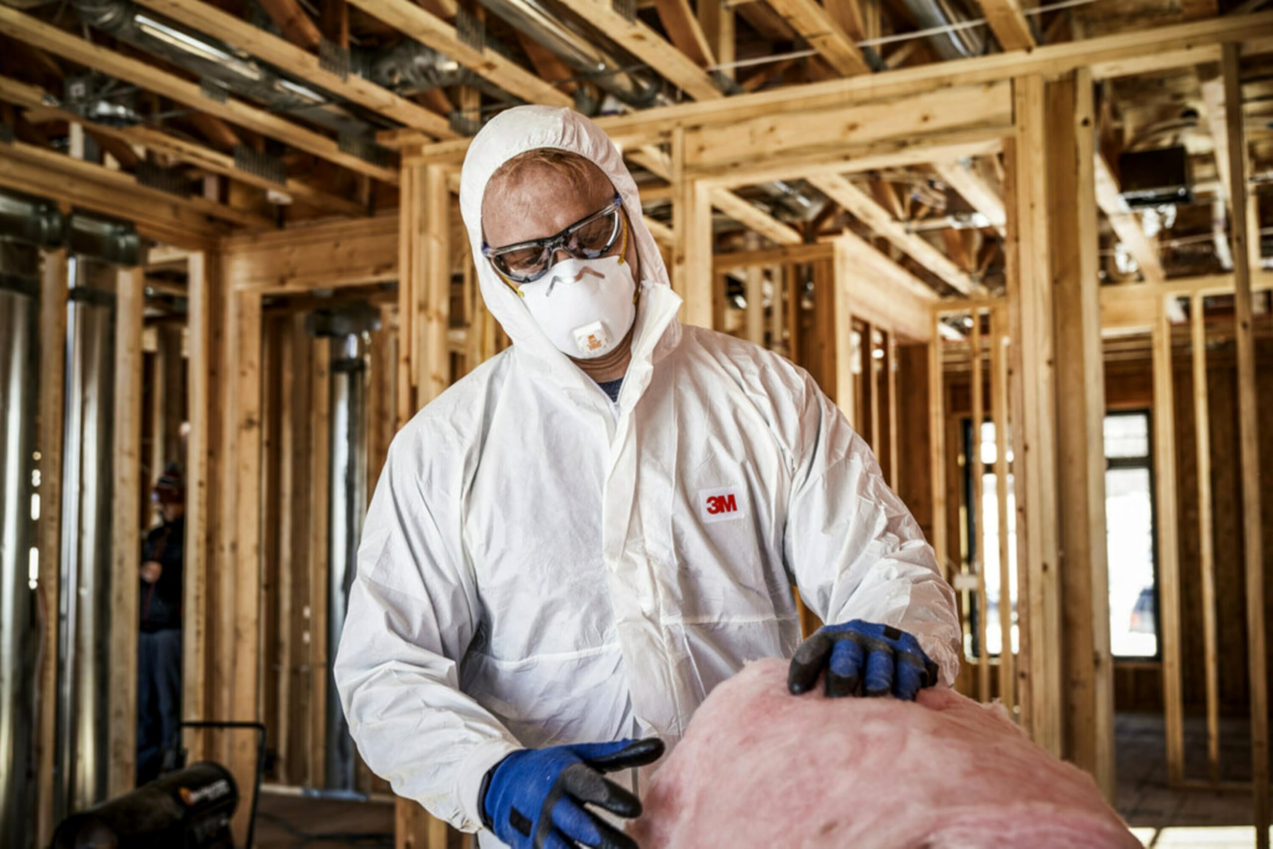 3M 8511 respirator in use while sanding illustrating dust protection