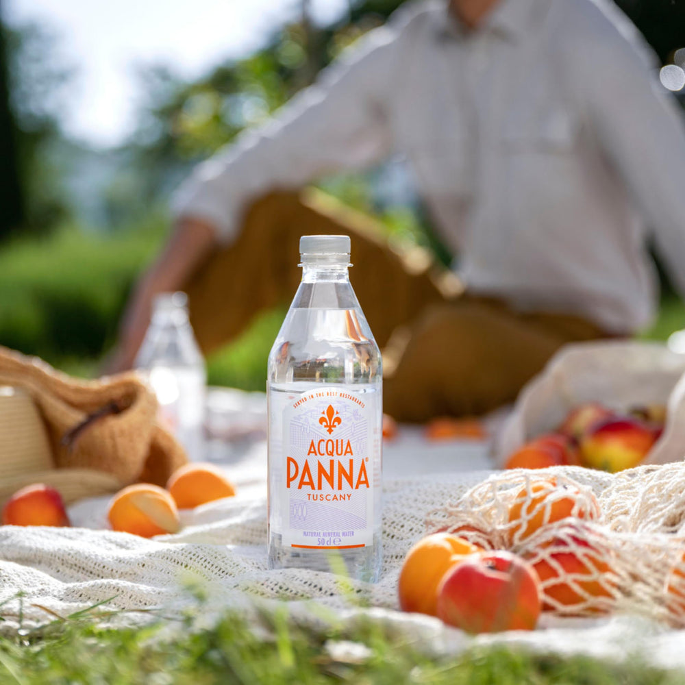 Acqua Panna on a dining table enhancing food and wine pairing