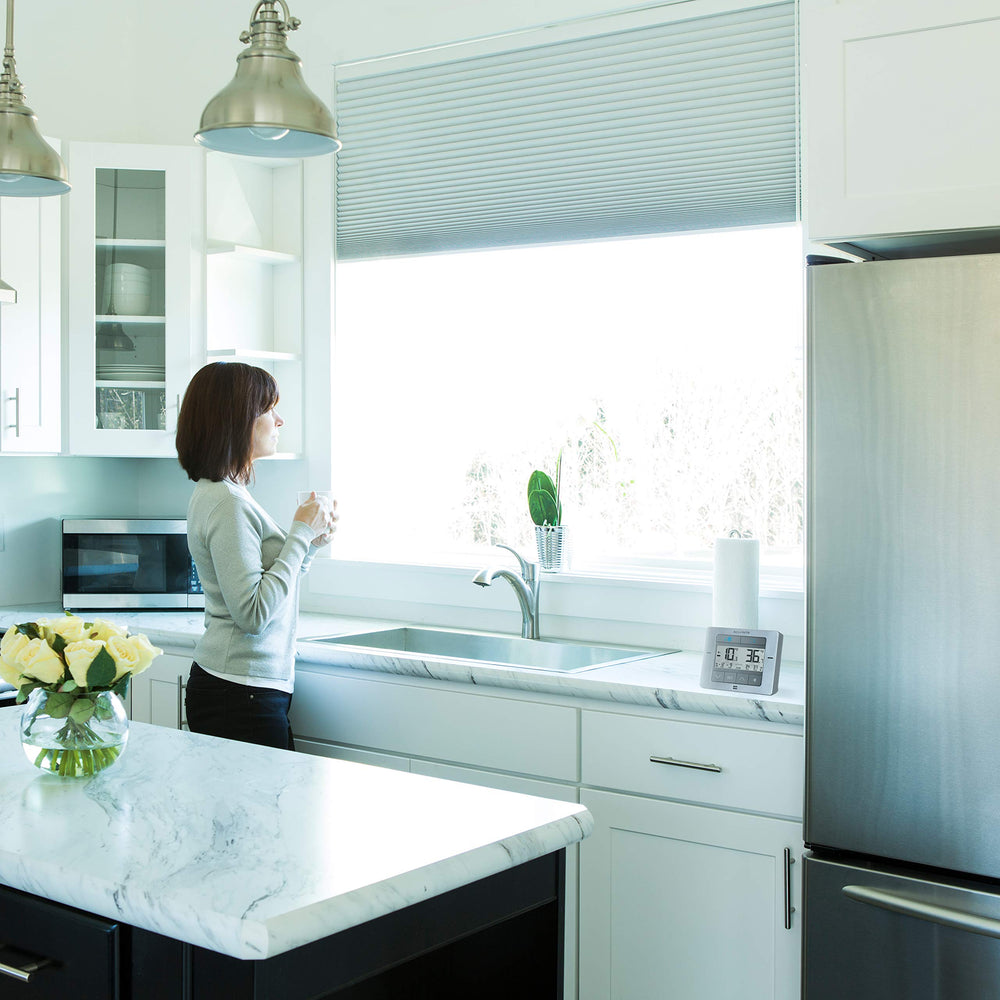 AcuRite display magnetically mounted to fridge exterior for convenient countertop-free placement and visibility