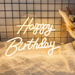Adnkwolivt front view of sign showing warm white glow and party impact