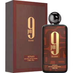 Afnan 9 PM Elixir bottle beside packaging conveying premium presentation and gift readiness