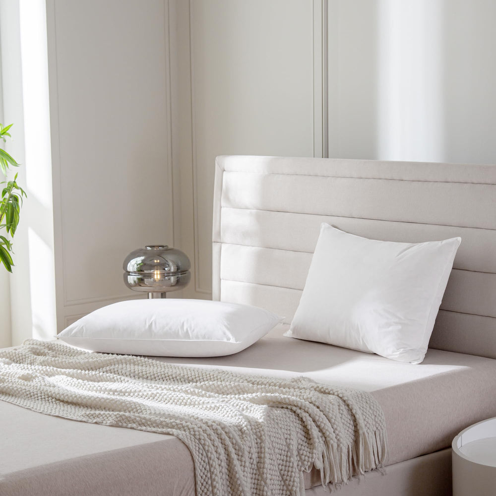 AIKOFUL compressed rolled pillow in delivery package showing easy shipping benefit