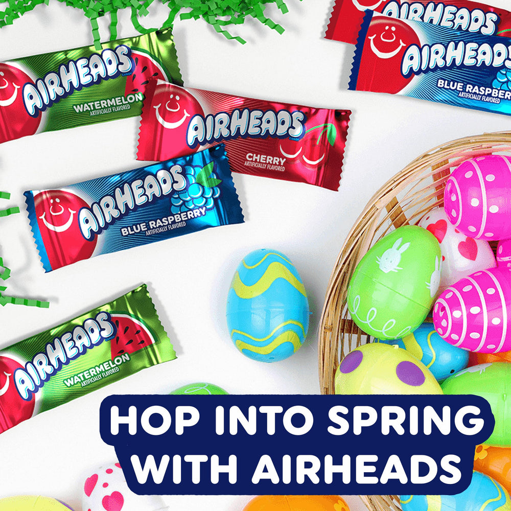 Close crop of Airheads being stretched to emphasize chewy texture and playful eating