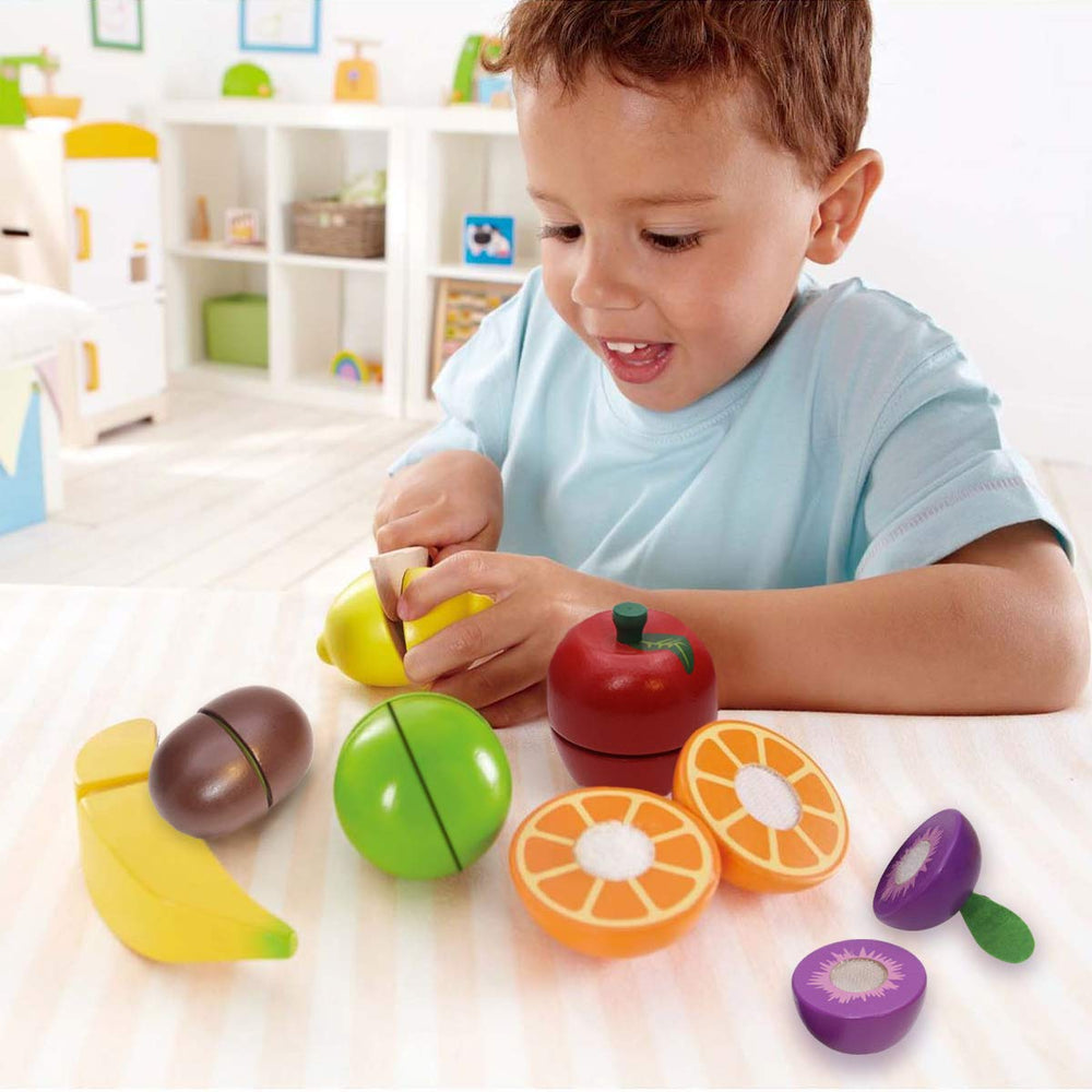 Airlab fruit pieces next to an adult hand for scale — perfect size for small hands benefit