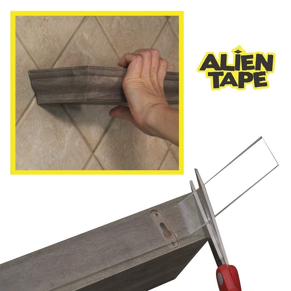 ALIEN TAPE next to a hand to show roll width and length for planning