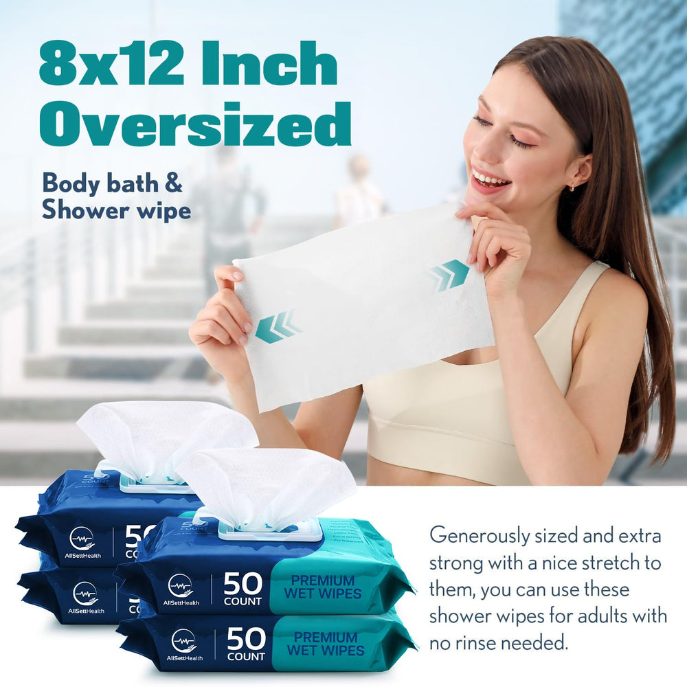 AllSett Health wipe in hand demonstrating large 8x12 size for efficient cleansing