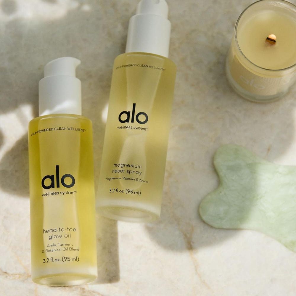 Alo bottle in hand to show 3.2 oz travel size and portable convenience