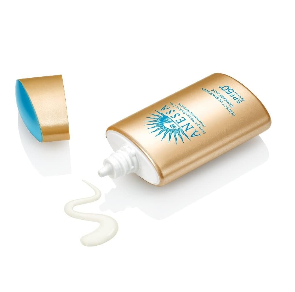 Anessa Perfect UV Skin Care Milk N milky texture on fingertip demonstrating smooth spreadability and lightweight hydration